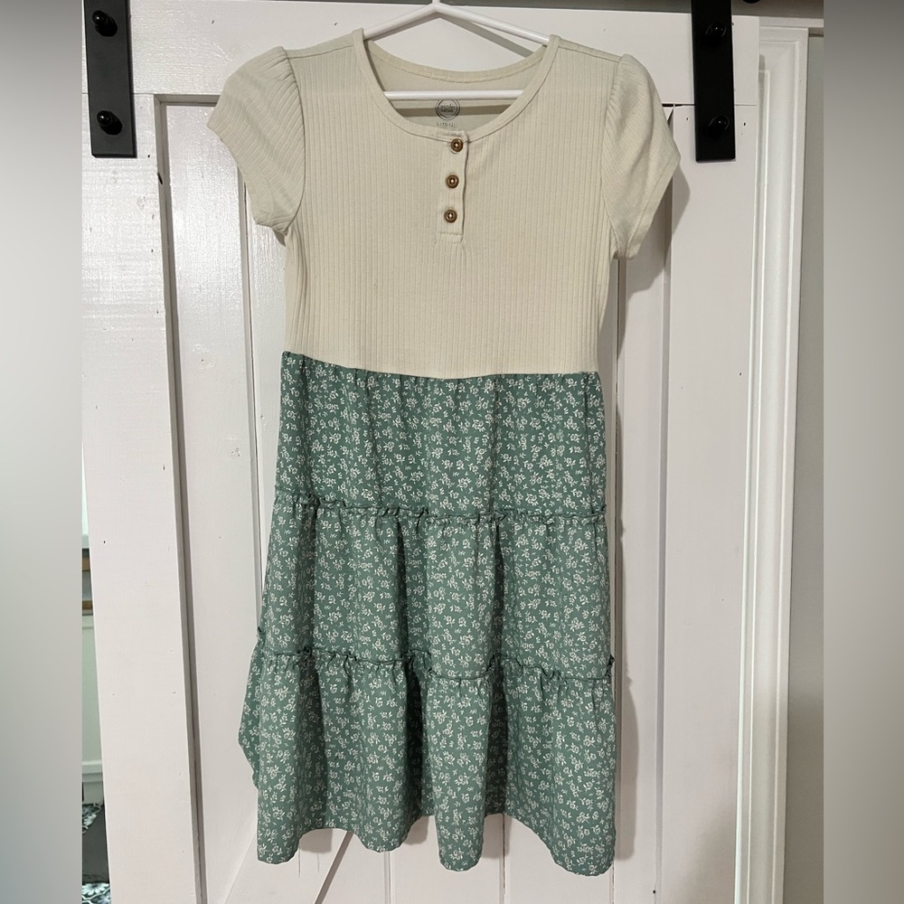 Girls knee length dress green floral bottom and cream top. Short sleeve